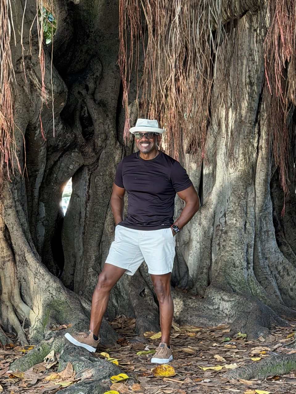 Grantley McLeod standing beside a large tree